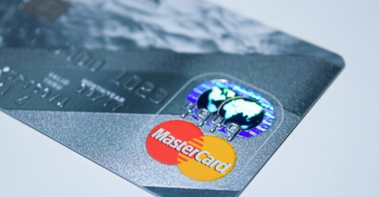 Detail shot of a MasterCard credit card, showing the chip and logo.
